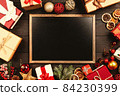 Christmas background with gift boxes on wooden table 84230399