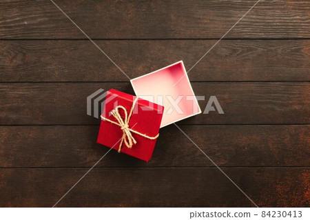 Christmas background with gift boxes on wooden table 84230413