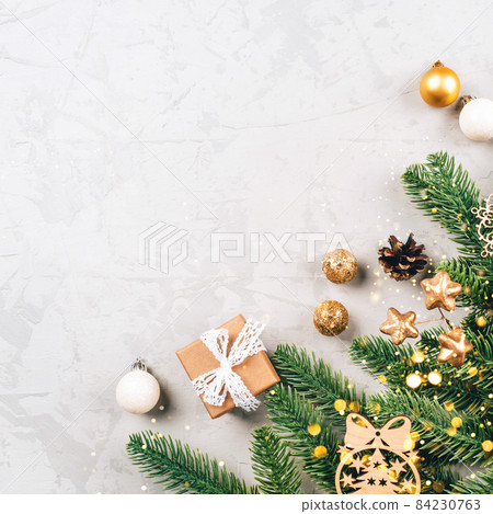 Christmas composition of fir tree branches and decorations. 84230763