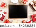 Christmas background with gift boxes on wooden table 84230884