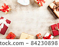 Christmas background with gift boxes on wooden table 84230898