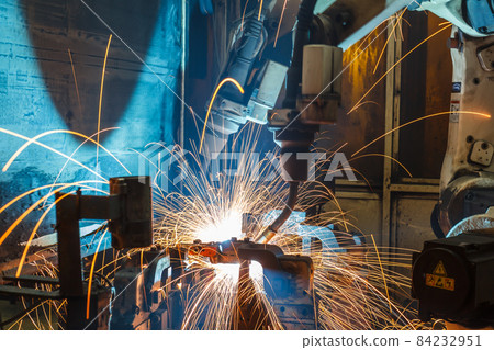 robots welding in a car factory 84232951