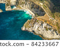 Aerial shot at sea with turquoise water and rocks. Atuh beach, Nusa Penida, Bali, Indonesia. 84233667