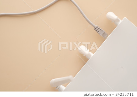 Wi-Fi router with cables on table Wi-Fi router with cables on table 84233711