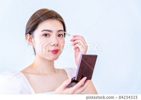 Beauty photo of young woman Eyebrow makeup Beauty photo of young woman Eyebrow makeup 84234315