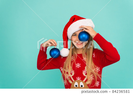 Decorative accessories. Decorating christmas tree. Girl Decorative accessories. Decorating christmas tree. Girl 84236581