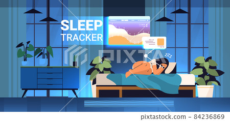 young woman sleeping in bed with electronic smart watch app tracker on hand quality and quantity sleep control young woman sleeping in bed with electronic smart watch app tracker on hand quality and quantity sleep control 84236869