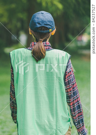 Volunteer picking up trash 84237527