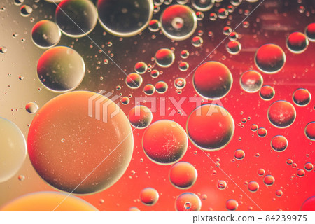 Red abstract background picture made with oil, water and soap Red abstract background picture made with oil, water and soap 84239975