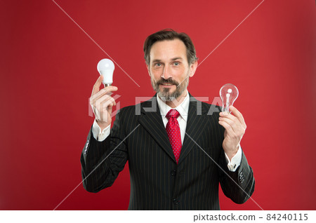 Man bearded businessman formal suit hold light bulb  84240115