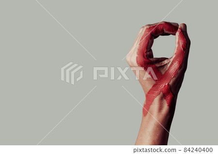red ribbon for the fight against AIDS in his hand 84240400