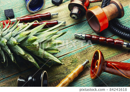 Smoking hookah with fruit Smoking hookah with fruit 84241618