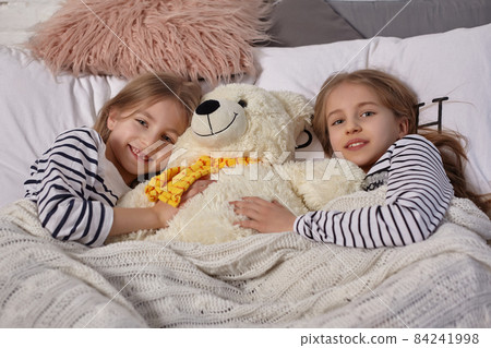 The image of two little sisters awakes in the morning The image of two little sisters awakes in the morning 84241998
