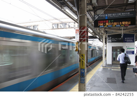 Keihin Tohoku Line rapid train passing through Nippori Station Keihin Tohoku Line rapid train passing through Nippori Station 84242255
