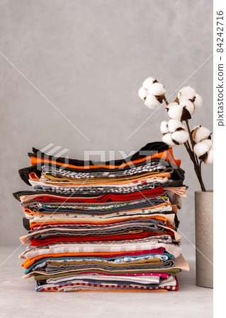 Natural kitchen napkins in a stack close-up Natural kitchen napkins in a stack close-up 84242716