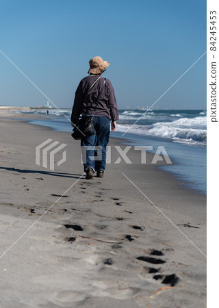 Walking on a sandy beach Walking on a sandy beach 84245453