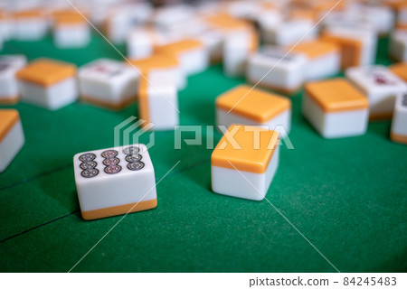 Playing mahjong at the electric mahjong table Playing mahjong at the electric mahjong table 84245483