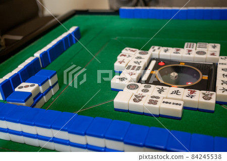 Mahjong tiles on the electric mahjong table 84245538