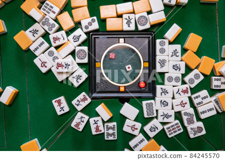 Mahjong tiles on the electric mahjong table 84245570