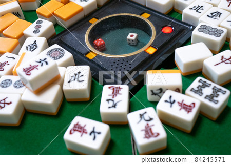Mahjong tiles on the electric mahjong table 84245571