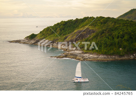 Tourists at Phromthep cape viewpoint at the south of Phuket Island, Thailand. Tropical paradise in Thailand. Phuket is a popular destination famous for tourists 84245765