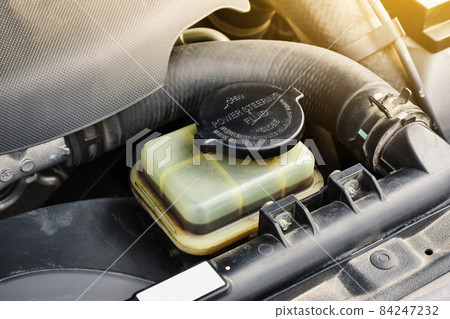 Power steering fluid reservoir of the hydraulic steering wheel in the car Power steering fluid reservoir of the hydraulic steering wheel in the car 84247232
