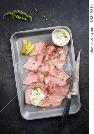 Traditional lunch meat with sliced cold cuts roast beef and remoulade Traditional lunch meat with sliced cold cuts roast beef and remoulade 84249316