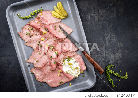 Traditional lunch meat with sliced cold cuts roast beef and remoulade Traditional lunch meat with sliced cold cuts roast beef and remoulade 84249317