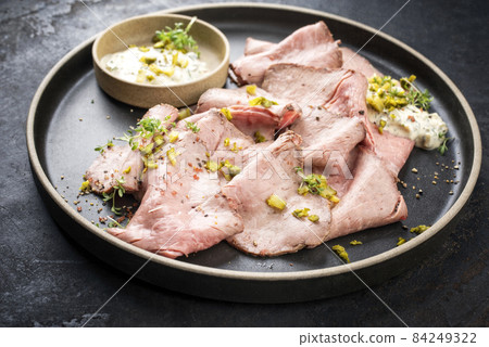 Traditional lunch meat with sliced cold cuts roast beef and remoulade Traditional lunch meat with sliced cold cuts roast beef and remoulade 84249322
