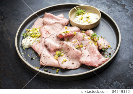 Traditional lunch meat with sliced cold cuts roast beef and remoulade Traditional lunch meat with sliced cold cuts roast beef and remoulade 84249323