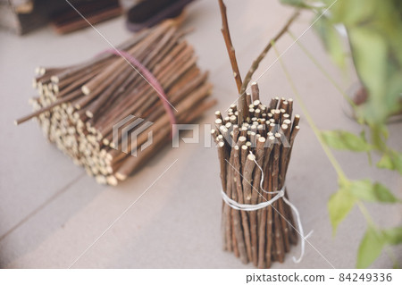 Eco-friendly toothbrushes on neem tree branches for sale on Varanasi Street, a Hindu sanctuary in North India Eco-friendly toothbrushes on neem tree branches for sale on Varanasi Street, a Hindu sanctuary in North India 84249336