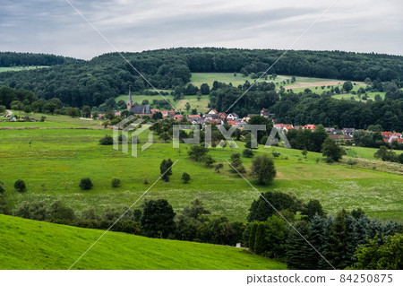 Tele view of the village of Ruckersbach in the hills, Ruckersbach, Germany, August 2017 Tele view of the village of Ruckersbach in the hills, Ruckersbach, Germany, August 2017 84250875
