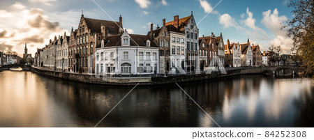 Bruges, West Flemish Region, Belgium - 11 15 2017: The Spiegelrei historical  street reflecting in the canal 84252308