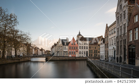 Bruges, West Flemish Region, Belgium - 11 15 2017: The Spiegelrei historical  street reflecting in the canal 84252309