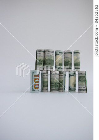 The construction from 100 dollars banknotes. Money construction. 84252562