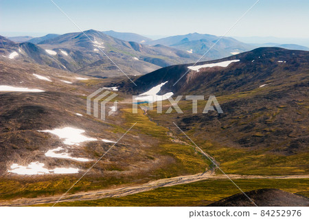Aerial photo of the summer arctic landscape with mountains and tundra. Chukotka, Russia. 84252976