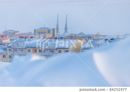 Winter view of a snow-covered northern city in the Arctic. Winter view of a snow-covered northern city in the Arctic. 84252977