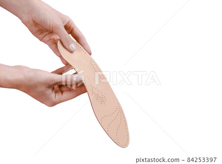 Orthopedic insole isolated on a white background. Medical insoles. Treatment and prevention of flat feet and foot diseases. Foot care, feet comfort. Wear comfortable shoes. Flat Feet Correction. Orthopedic insole isolated on a white background. Medical insoles. Treatment and prevention of flat feet and foot diseases. Foot care, feet comfort. Wear comfortable shoes. Flat Feet Correction. 84253397