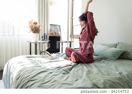 A woman in the bedroom A woman in the bedroom 84254753