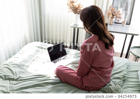 A woman in the bedroom 84254973