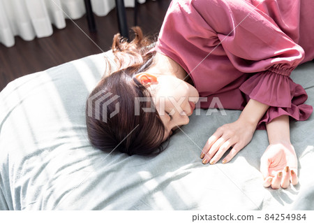 A woman in the bedroom 84254984