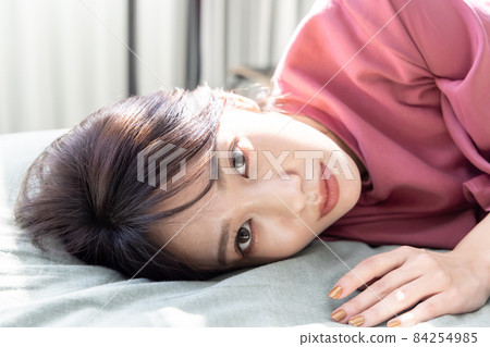 A woman in the bedroom 84254985