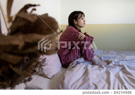 A woman in the bedroom 84254986