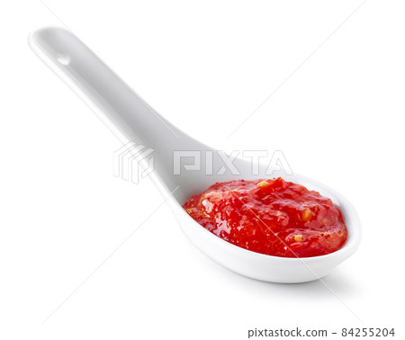spoon of hot chili sauce 84255204