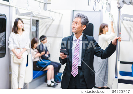 People traveling by train or subway People traveling by train or subway 84255747
