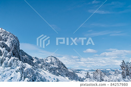 Winter wonderland and Christmas landscape. Snowy mountains covered with snow as holiday background 84257980