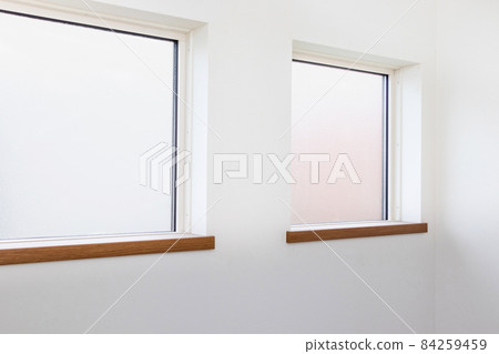 White walls and square glass windows White walls and square glass windows 84259459