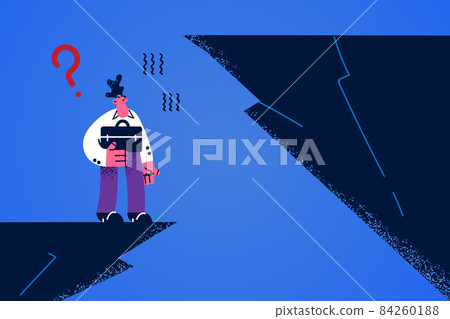 Businessman on edge of rock think of business risks  84260188