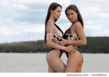 Sexy women in swimsuits on beach - Stock Photo [84260626] - PIXTA