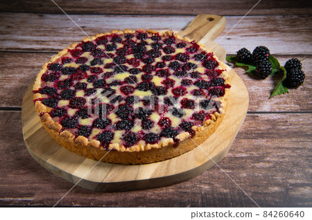 Homemade pie closeup on blackberries. 84260640